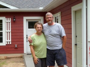 Craig and Diane outside their new house