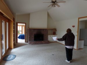 Living room featured cathedral ceiling and fireplace