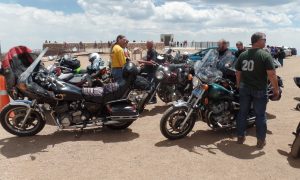 Our guys and bikes, top of Pike's Peak. My red jacket (left) is on my Concours.