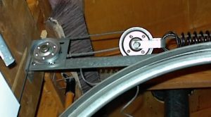 Top pulley and spring pulley; I replaced the top pulley at upper left