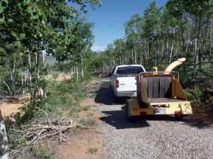 Truck pulling brush chipper