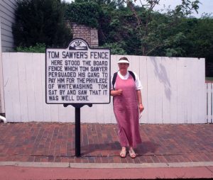 Pam by a Tom Sawyer sign