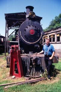 Jerry poses by old steam locomotive